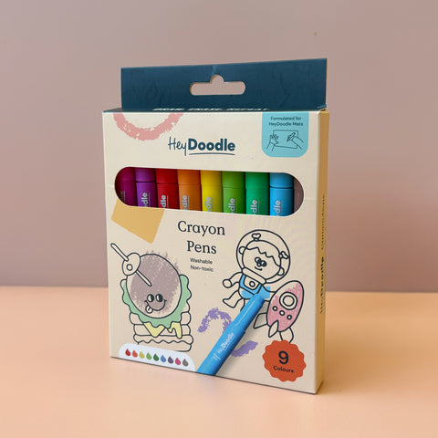 HeyDoodle’s 9 vivid, non-toxic silicone crayon pens in pastel, animal-themed packaging—perfect for coloring reusable mats.